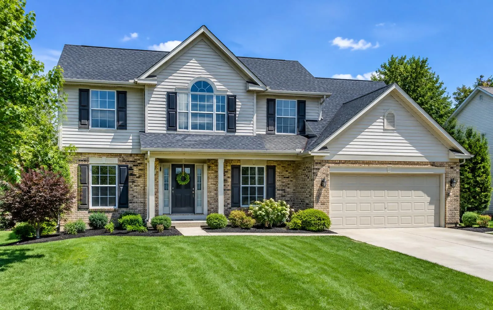 Two-story Hamilton, Ohio area home with a new charcoal shingle roof