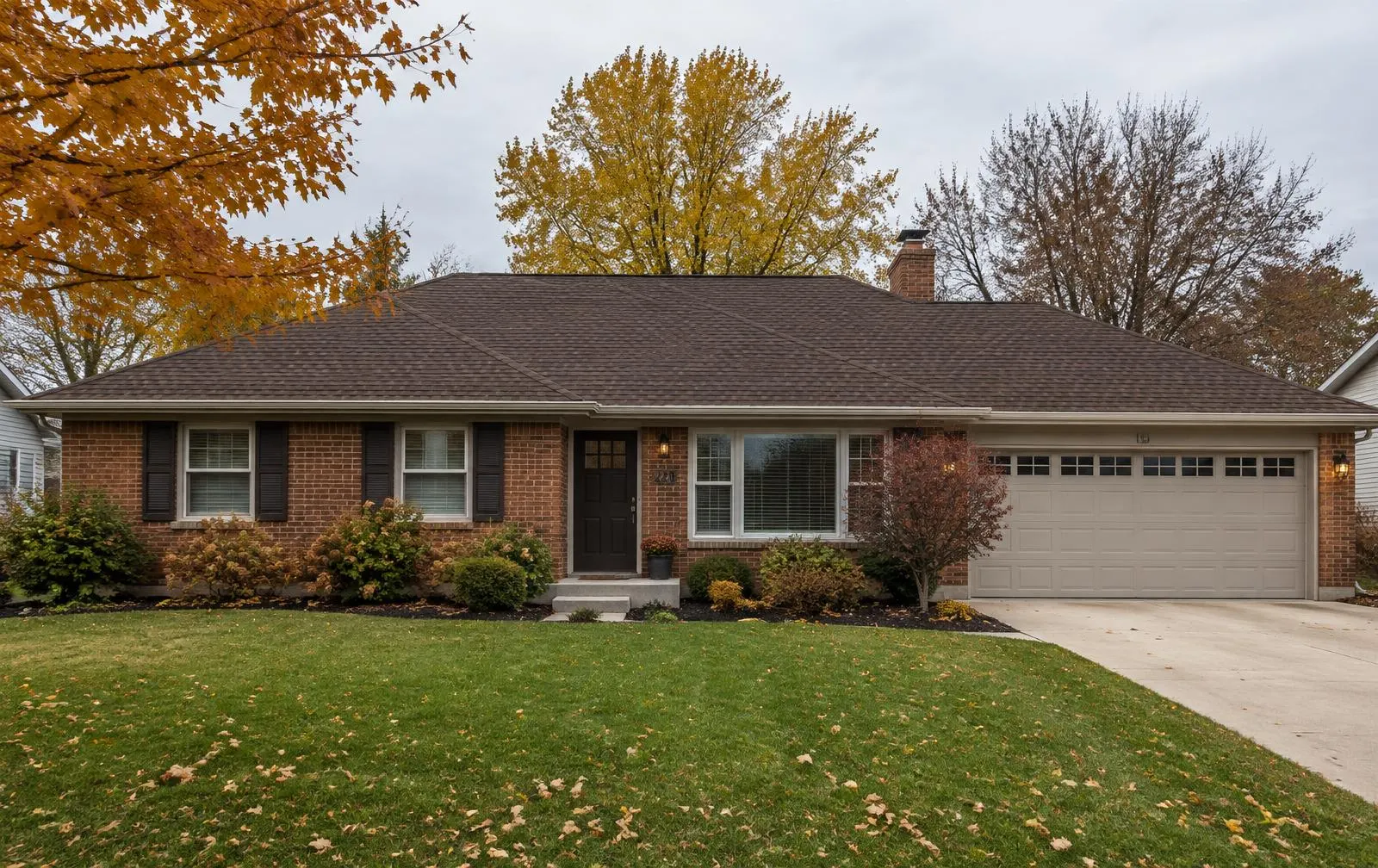 Brick ranch home with a new brown shingle roof near Fairfield, Ohio